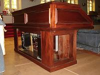  The new organ console with some of the electronics exposed. When a key or pedal is pressed, or a stop knob selected on the console, the action is translated into an electronic signal that is then sent via cable to the central chamber behind the exposed pipework of the facade.