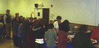  People from Park Methodist and Church on the Green line up to sample a diverse array of international dishes.